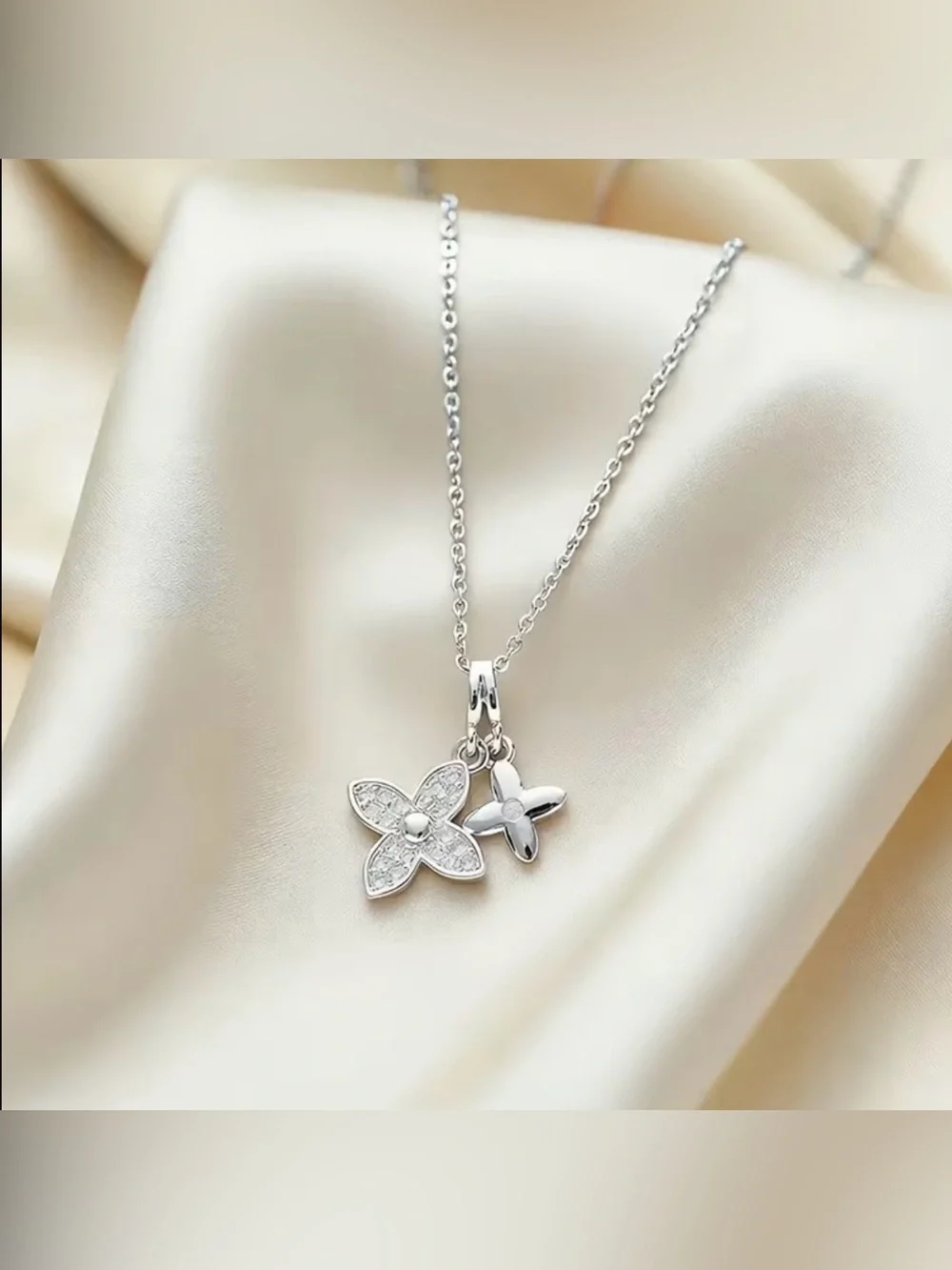 New silvery necklaces with pavé-set CZ stones a four-leaf clover pendant